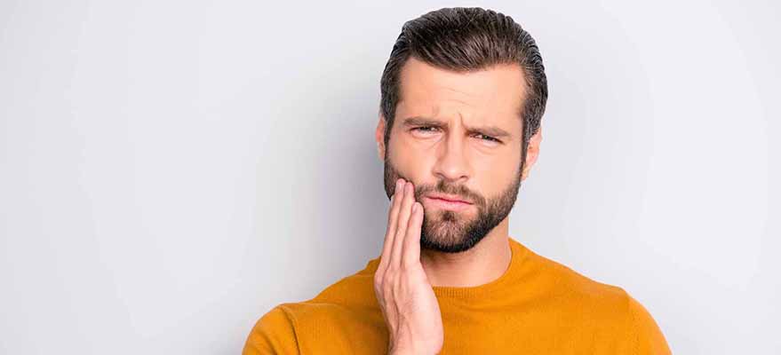 Причины боли в зубах при надавливании