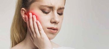 Боль после имплантации зубов